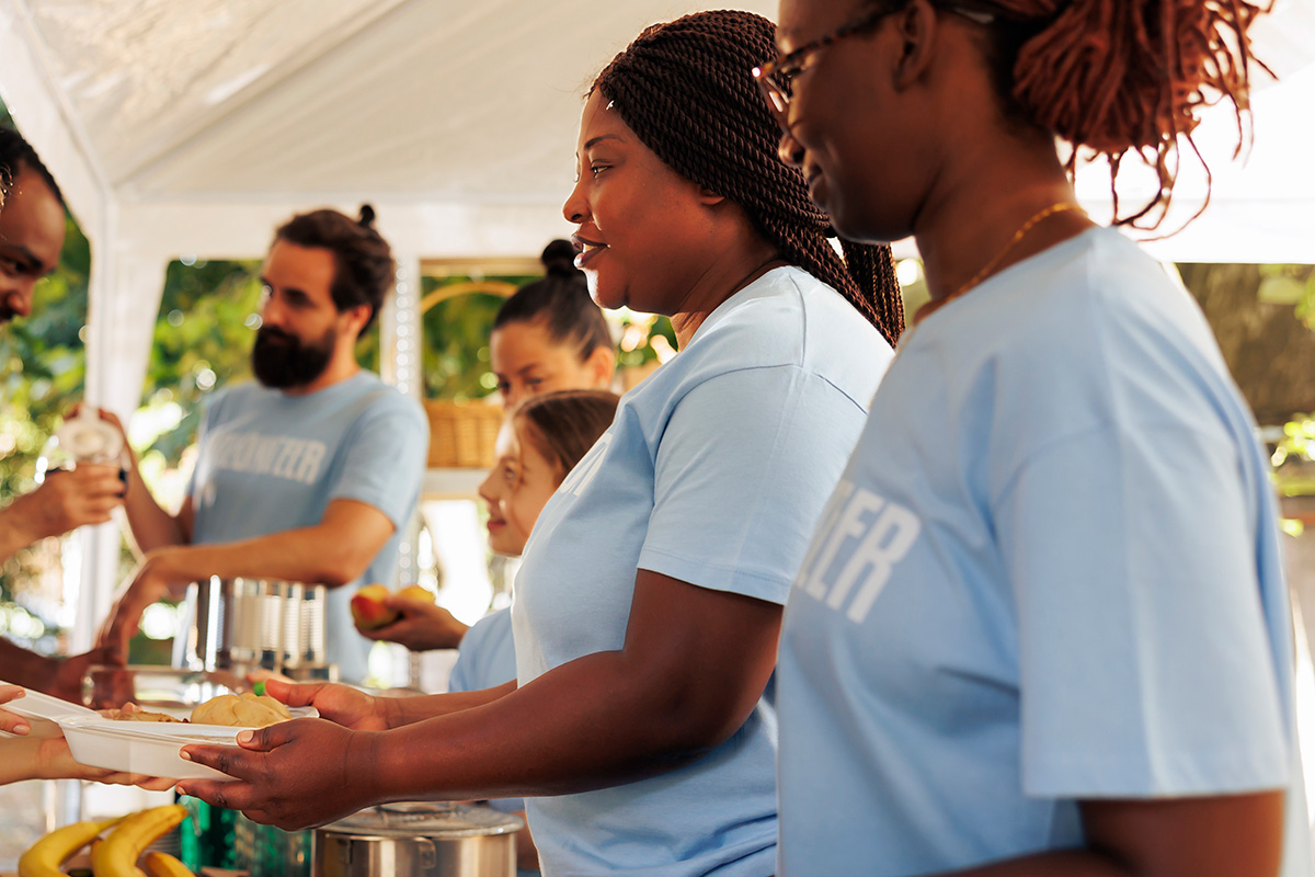 Volunteers serving meals at a community event