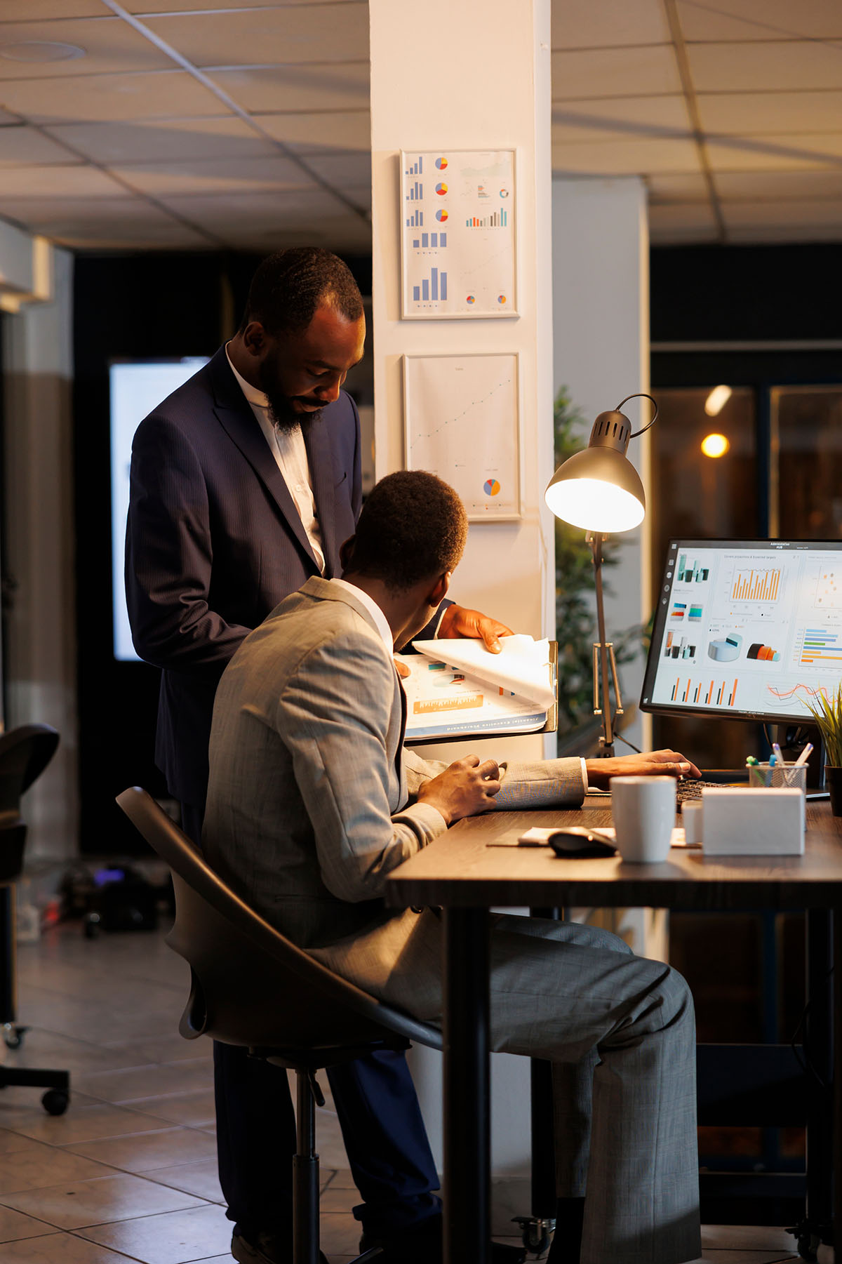 Evaluation team reviewing documents in an office